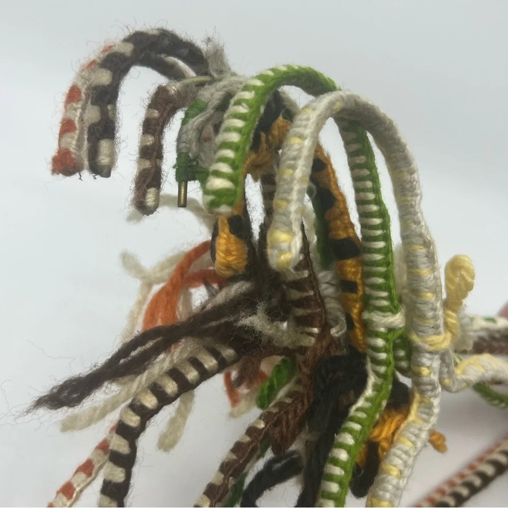 7 vintage wire hangers wrapped in yarn multi color as is
